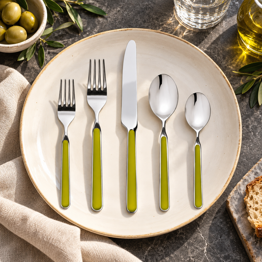 Mepra Fantasia Olive Green five-piece flatware on an ivory plate with linen