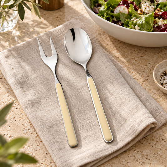 Mepra Fantasia Sesame two-piece serving set in a bright salad table setting